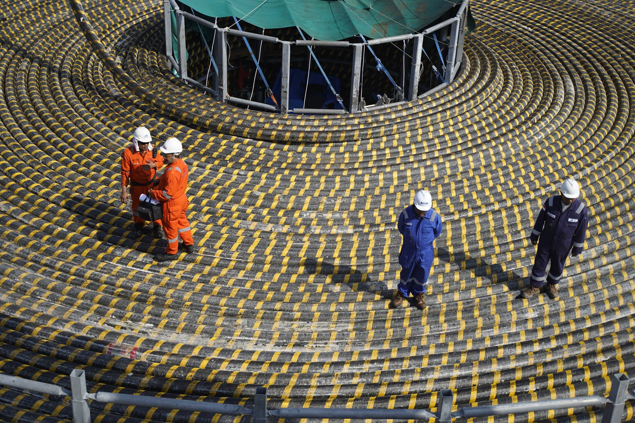 SGI crew standing on a coiled submarine cable