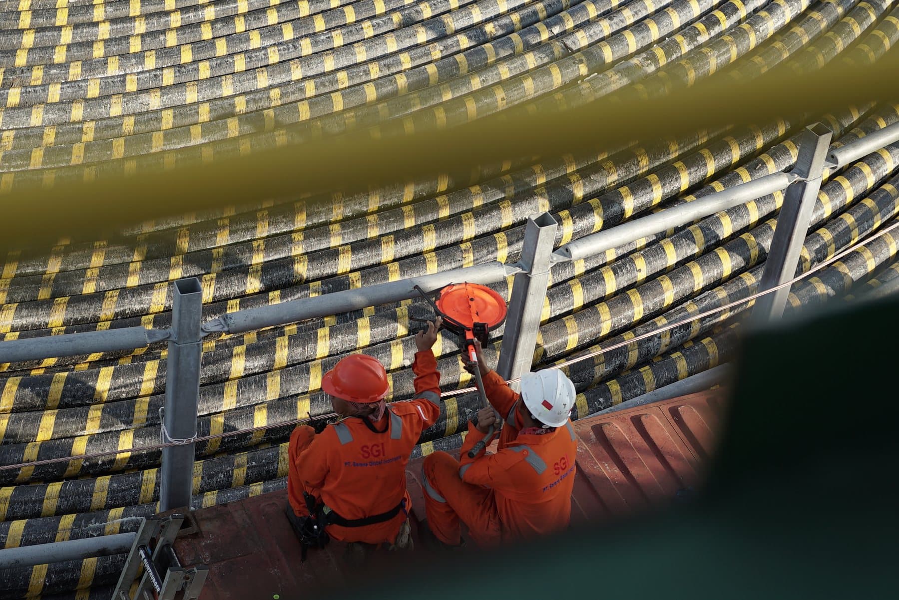 Two SGI crew members working at the cable tank